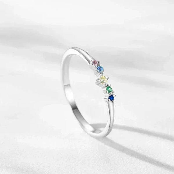 Prism Glow Stackable Ring - TM & Co. Jewels-Silver ring with multicolored gemstones on a light gray background.