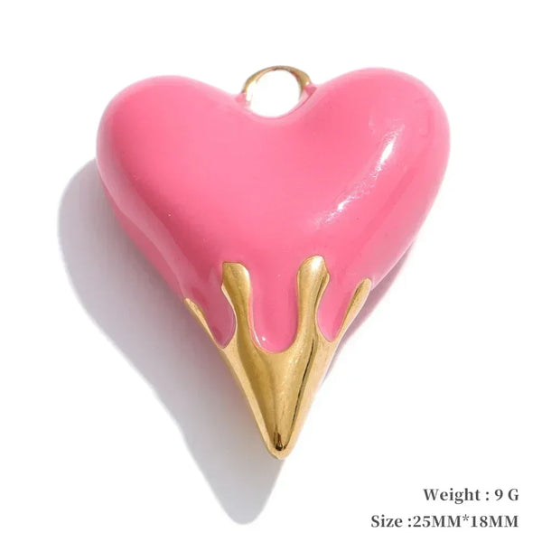 Pink heart-shaped pendant with gold accents on a white background