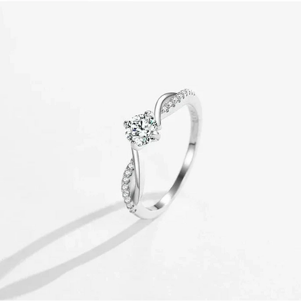 Silver ring with a diamond on a white background