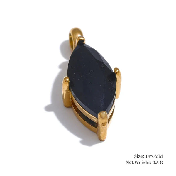 Gold pendant with a black stone on a white background