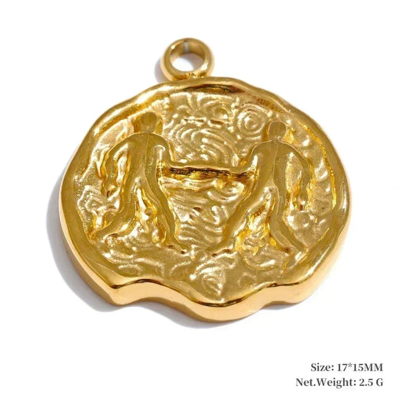 Gold pendant with intricate design on a white background