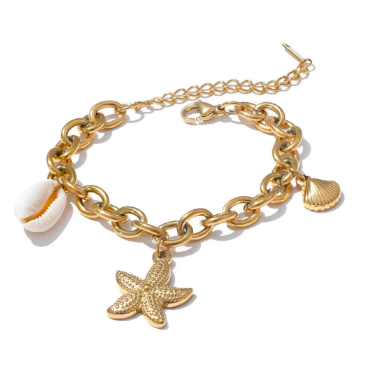 Gold chain bracelet with starfish and shell charms on a white background