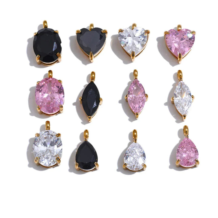 Collection of various gemstone pendants on a white background.