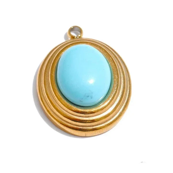 Turquoise stone pendant with gold wire wrapping on a white background