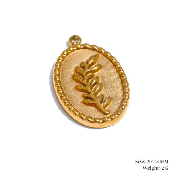 Gold pendant with leaf design on a white background