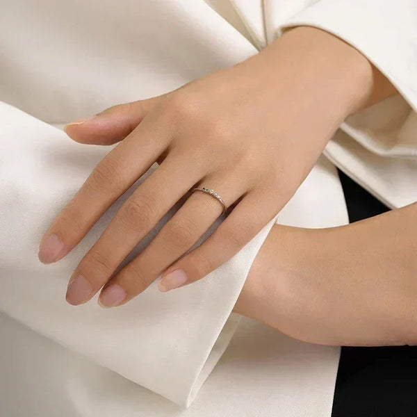 Close-up of a hand wearing Prism Glow Stackable Ring - TM & Co. Jewels