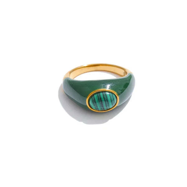 Green ring with gold accents on a white background.