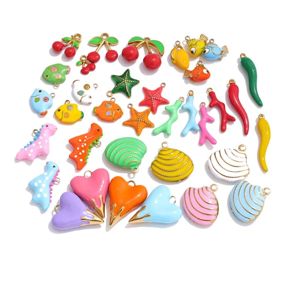 Assorted colorful jewelry charms on a white background.