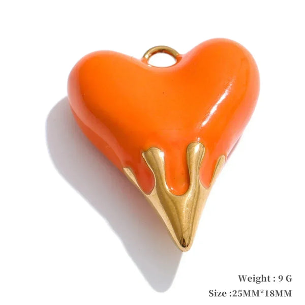 Orange heart-shaped pendant with gold base on a white background