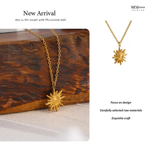 Gold sun-shaped necklace on a wooden surface with promotional text.