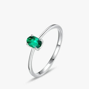 Pure Emerald CZ Ring - TM & Co. Jewels- Silver ring with a green gemstone on a white background.