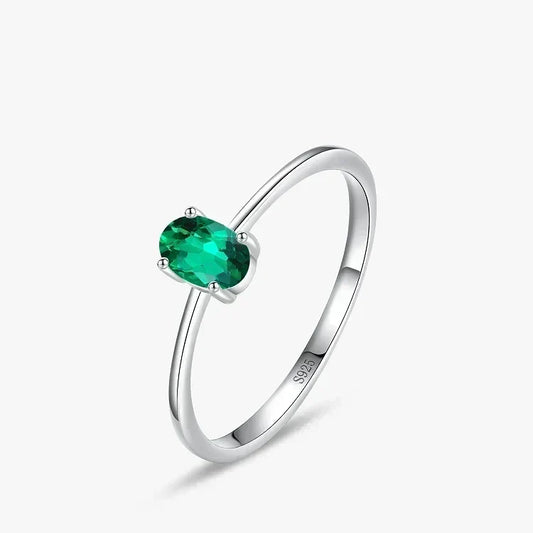 Pure Emerald CZ Ring - TM & Co. Jewels- Silver ring with a green gemstone on a white background.