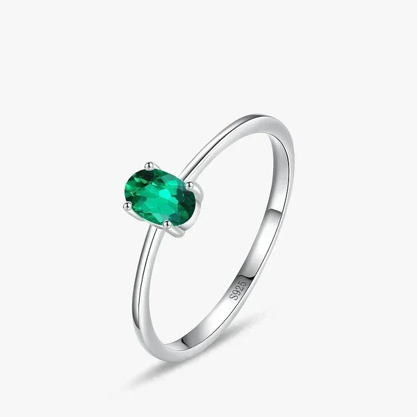 Pure Emerald CZ Ring - TM & Co. Jewels- Silver ring with a green gemstone on a white background.