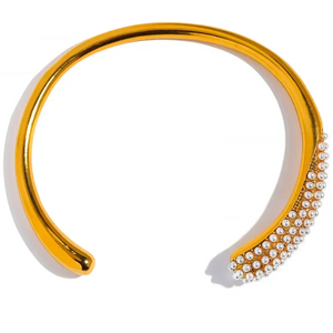 Gold headband with pearl embellishments on a white background