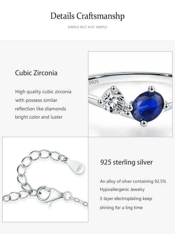 Silver ring with a round deep blue cubic zirconia stone and a small clear stone, shown with a close-up of the band stamped 5925 and a detail of the silver chain clasp.