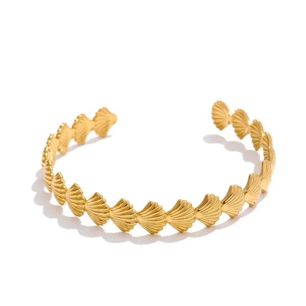 Gold headband with leaf-like designs on a white background