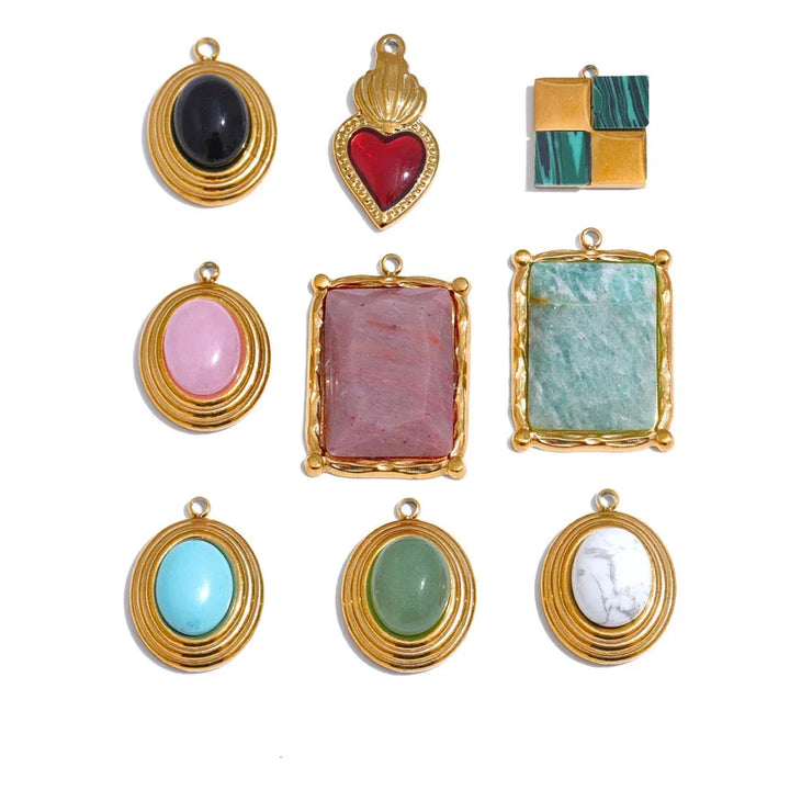 Collection of gold-framed gemstone pendants on a white background.