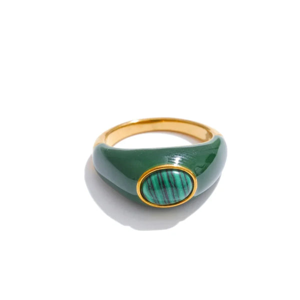 Gold and green ring with malachite stone on a white background