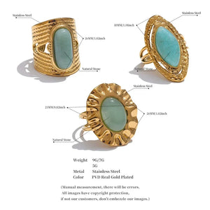 Gold rings with green stones on a white background