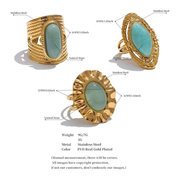 Gold rings with green stones on a white background