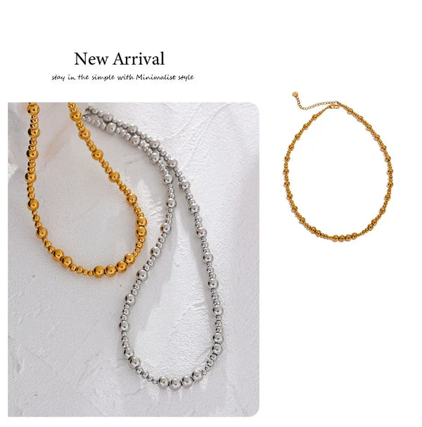Two beaded necklaces and a bracelet on a textured white surface with 'New Arrival' text.