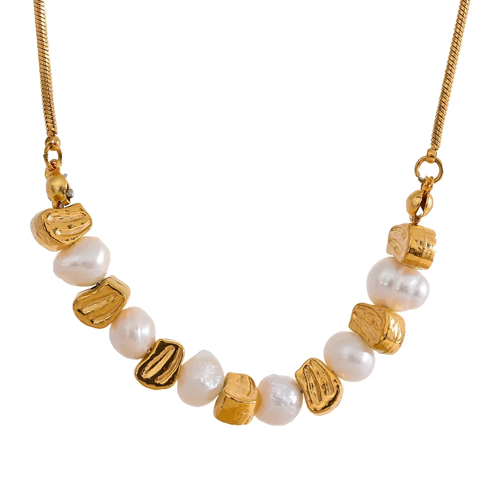 Necklace with gold and pearl beads on a white background.