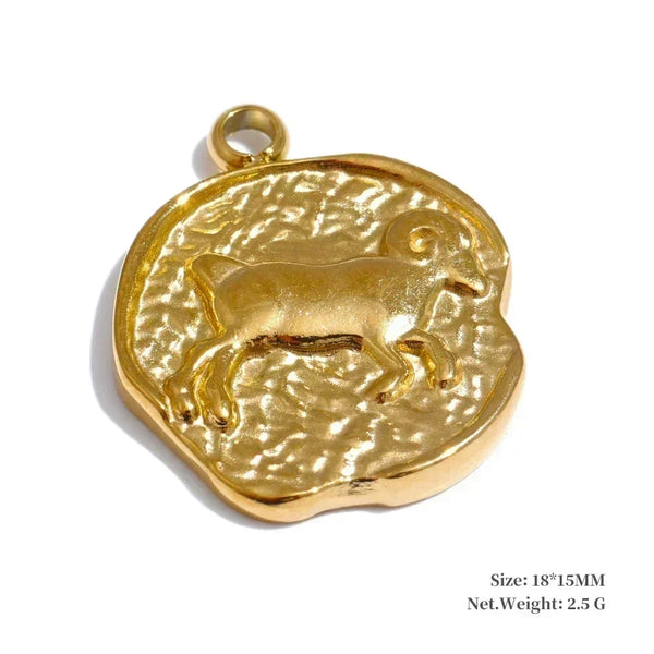 Gold pendant with a dog design on a white background