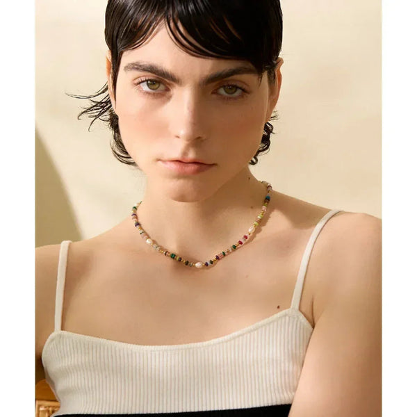 Woman wearing a colorful beaded necklace against a neutral background-Nouveau Bohème Necklace - TM & CO. JEWELS 