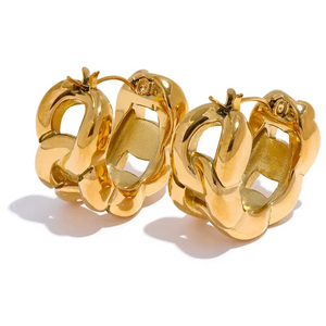 Pair of gold hoop earrings on a white background