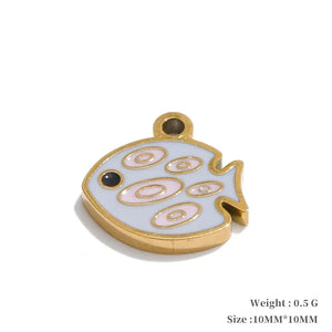 Small decorative fish-shaped object with gold border on a white background
