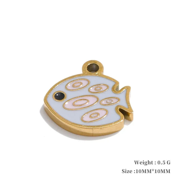 Small decorative fish-shaped object with gold border on a white background
