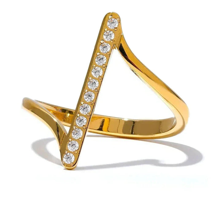 Gold ring with diamond accents on a white background