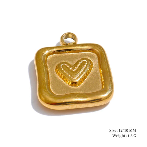 Gold pendant with a heart design on a white background