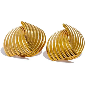 Pair of gold spiral earrings on a white background