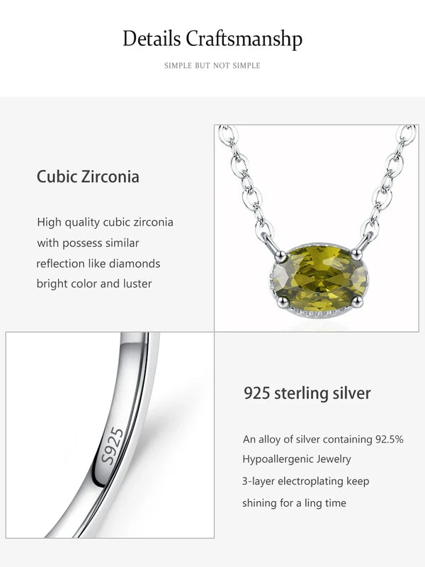 Silver necklace with a cubic zirconia pendant on a white background, featuring text details about the cubic zirconia and 925 sterling silver.