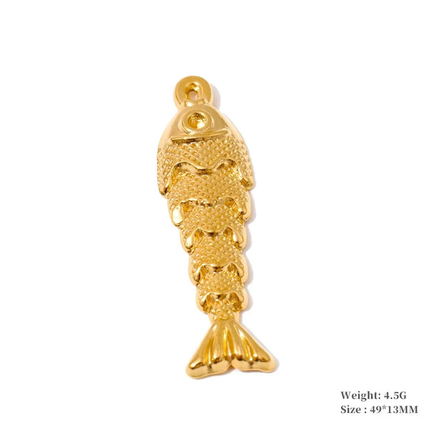 A gold-colored fish-shaped jewelry charm with a textured scale pattern and a hanging loop at the top, shown on a plain white background with small text in the bottom right indicating weight and size.