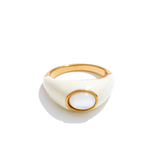 Gold and white ring on a white background