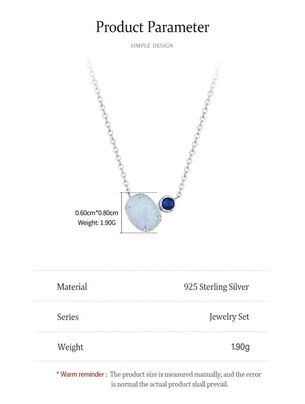 Product information card for a silver necklace with a large irregular white opal-like pendant and a small dark blue stone, shown on a white background with text listing material, series, weight, and size details.