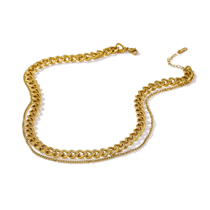 Gold chain necklace on a white background