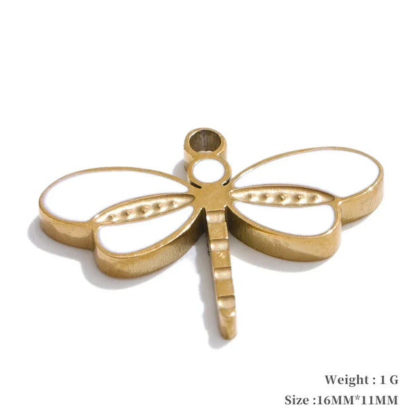 Gold dragonfly-shaped pendant on a white background