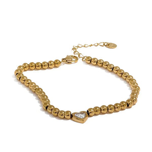 18K gold-plated beaded bracelet with a central heart-shaped charm and adjustable clasp