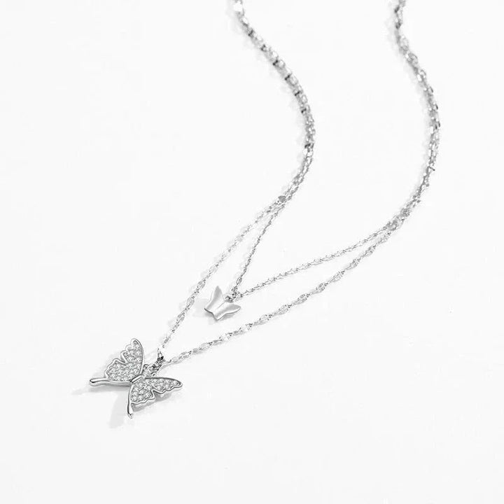 Silver butterfly necklace on a white background-Ethereal Wings Necklace - TM & CO. JEWELS 