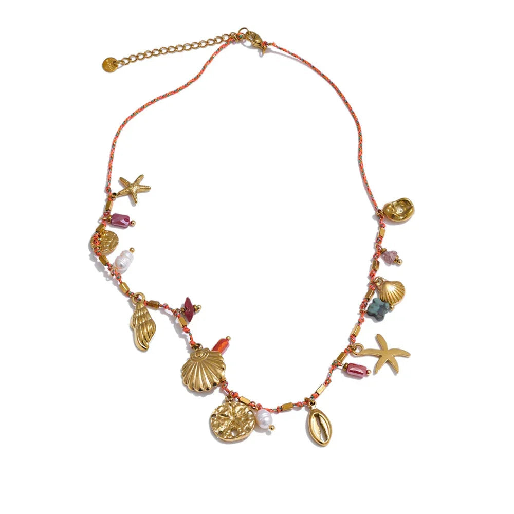 Necklace with seashell and starfish charms on a white background.