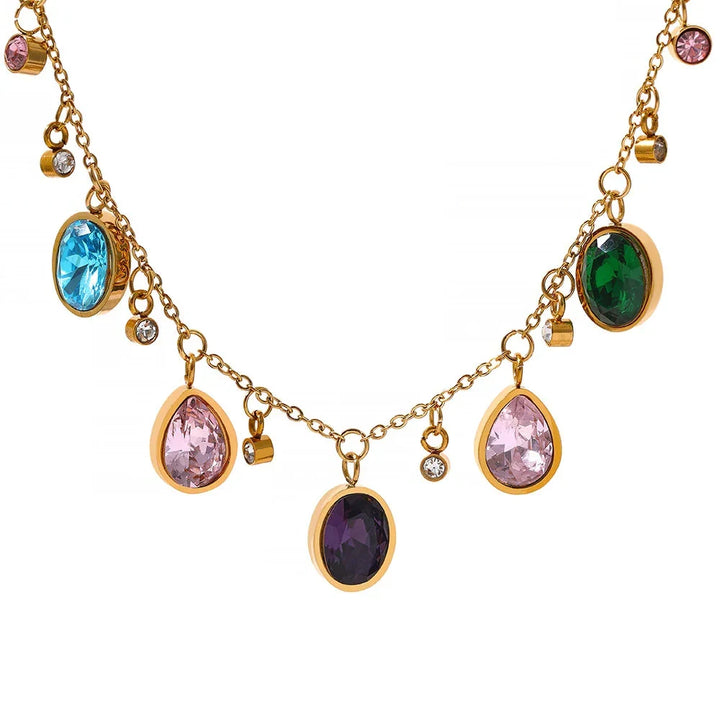 Gold necklace with colorful gemstones on a white background