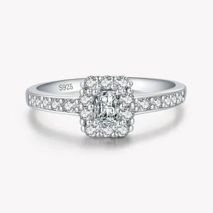 Sterling silver ring with square halo and pavé-set white stones, stamped S925.