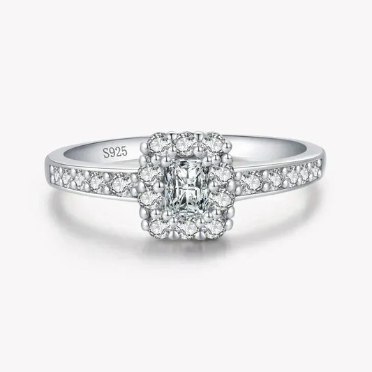 Sterling silver ring with square halo and pavé-set white stones, stamped S925.