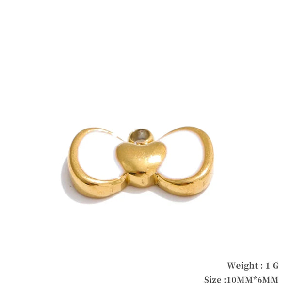 Gold-colored butterfly-shaped pendant on a white background