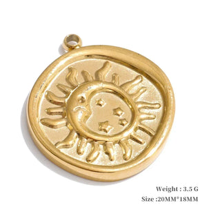 Gold pendant with sun and star design on a white background