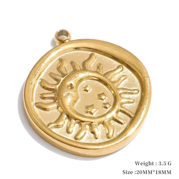 Gold pendant with sun and star design on a white background