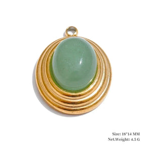 Gold pendant with a green stone on a white background